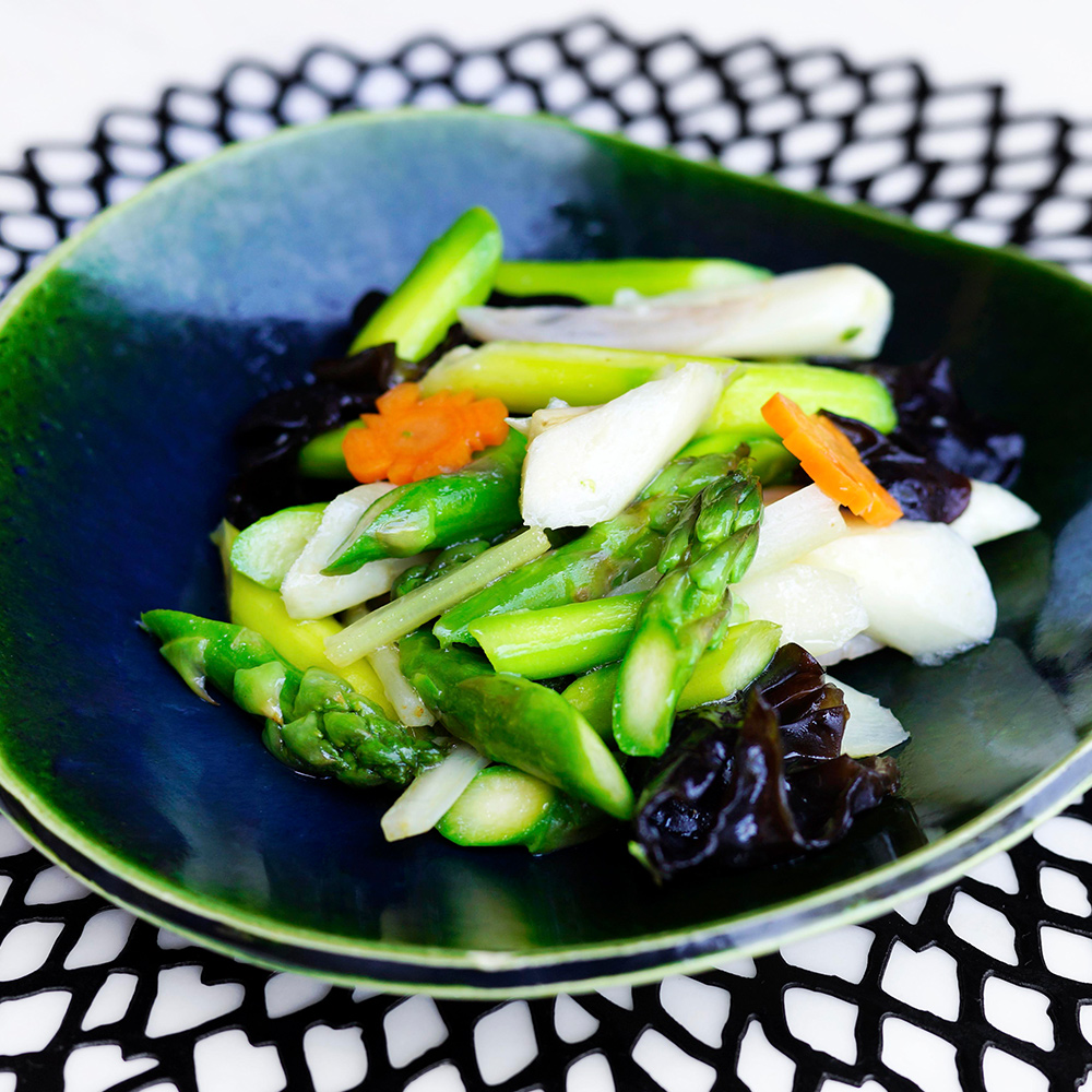 Stir-fried vegetables in a wok : Asparagus, lotus root, Chinese celery, daikon shoots, garlic, black mushroom